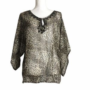 Dots semi sheer animal print top. Size Small